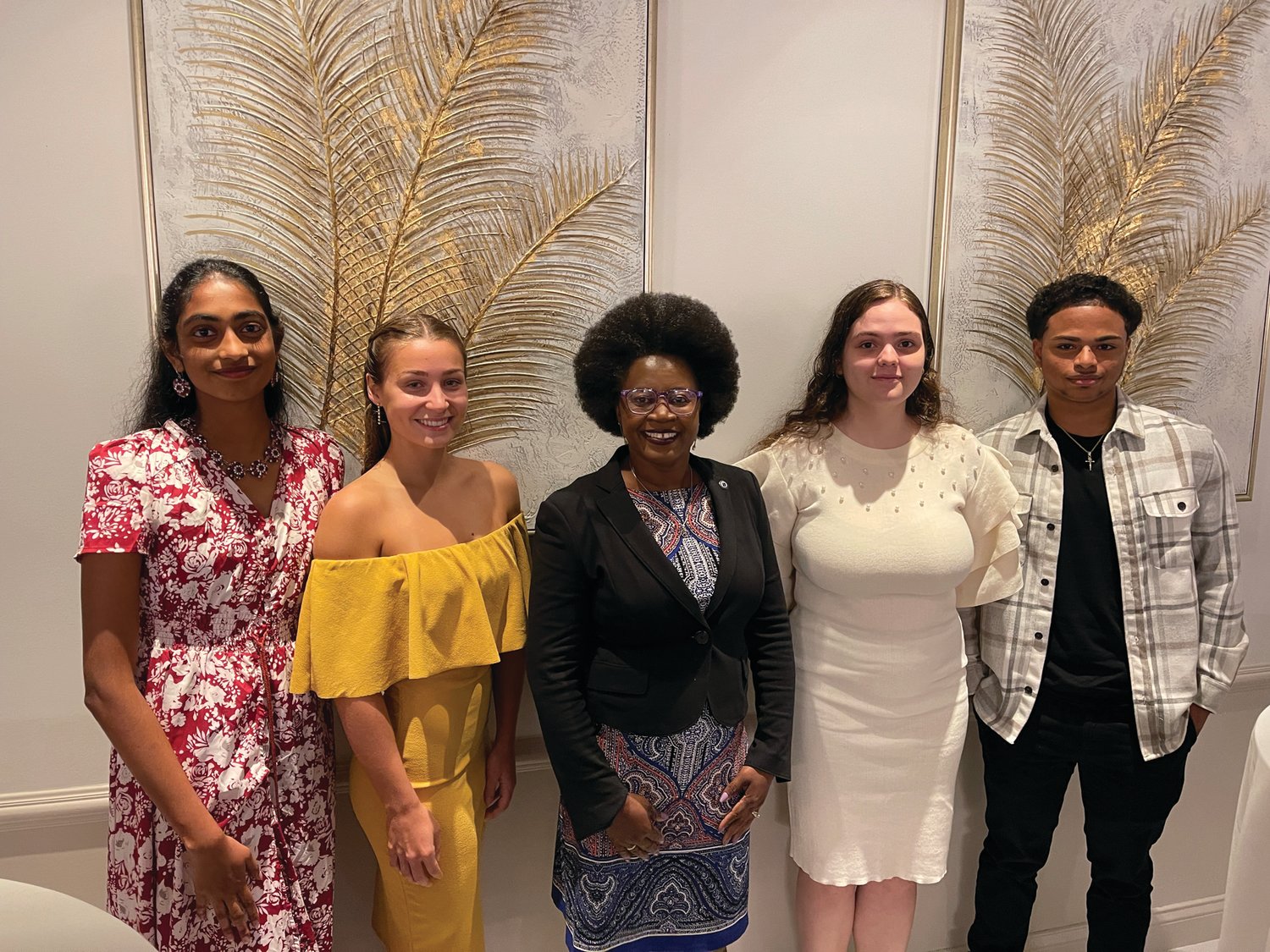 CONGRATULATIONS: Ward 2 City Councilwoman Aniece Germain, center, congratulates the four Hall of Fame scholarship recipients during an intermission at last week’s dinner. The scholars are, from left, Sanjana Ananthula, Mikaya Parente, Maria Silva and Xavier Pichardo.